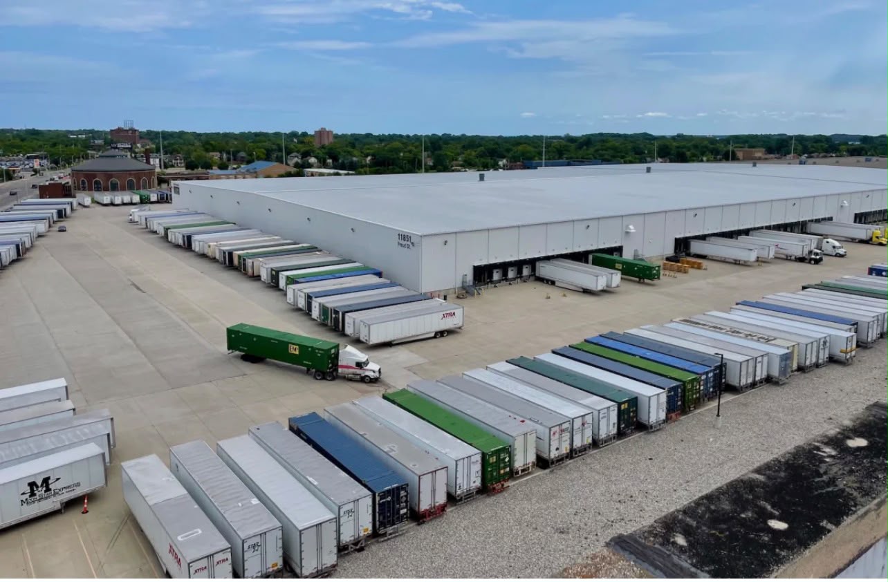 Commercial trucks staged in a logistics yard